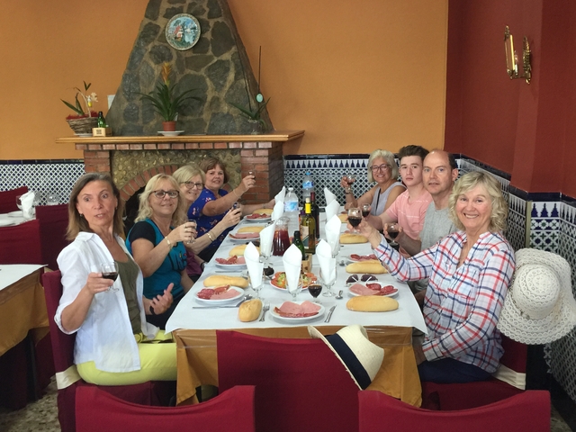 Group enjoying a meal at a restaurant.