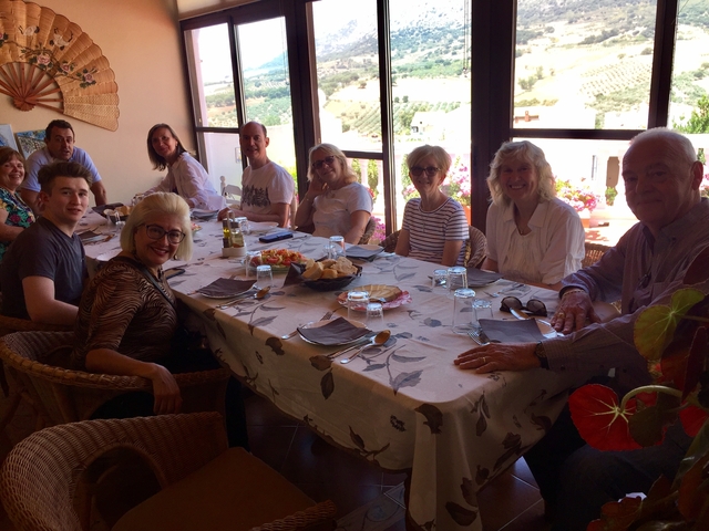 Group seated around a dining table indoors.