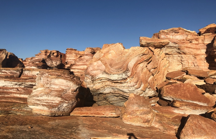 Red rock formations with a clear blue sky.