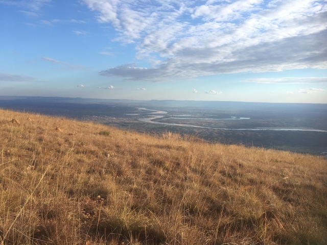 Expansive view of a river winding through a landscape.