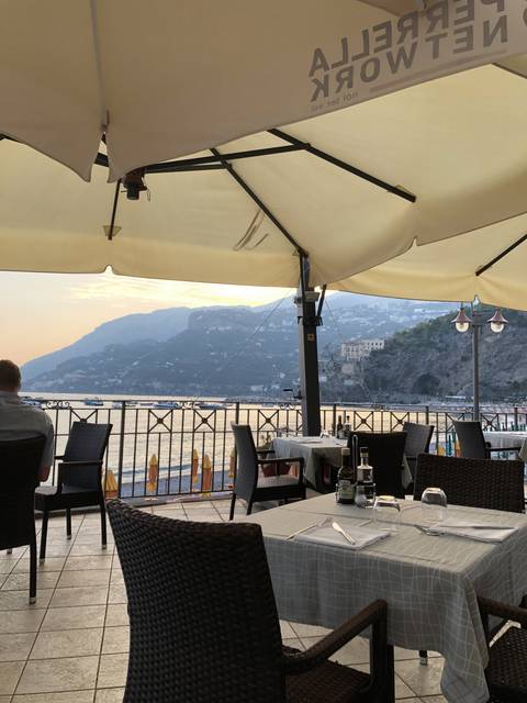       Outdoor restaurant setup with mountain view.
  