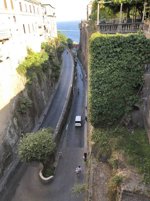       Winding road with a scenic cliffside view.
  