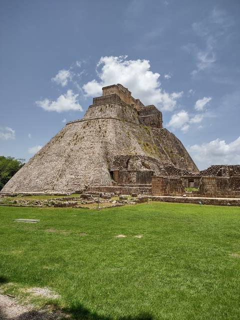      Ancient stone structure with large steep steps.
  