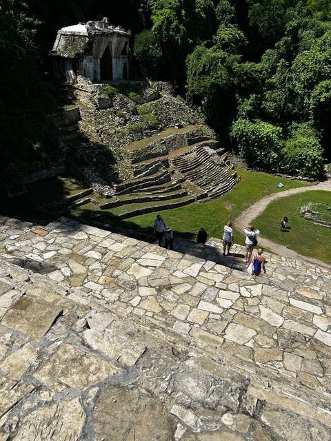       People exploring ancient ruins.
  