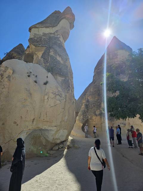       People exploring rock formations.
  