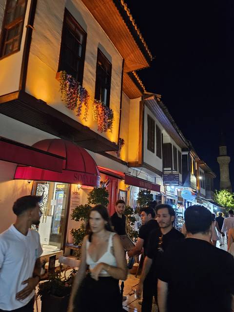       People in a lively night market.
  