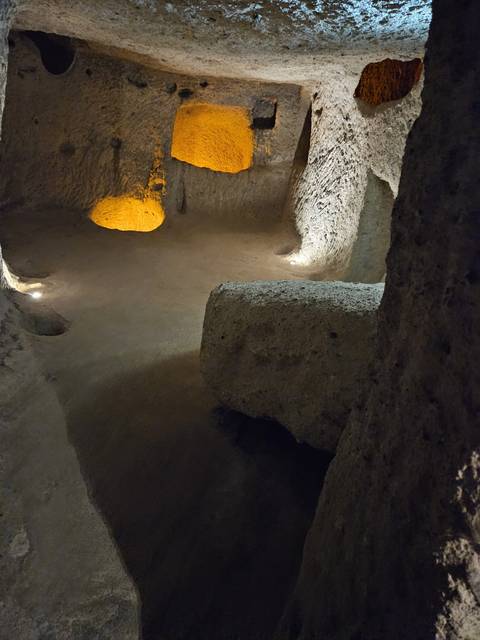      Underground cave room with lights.
  