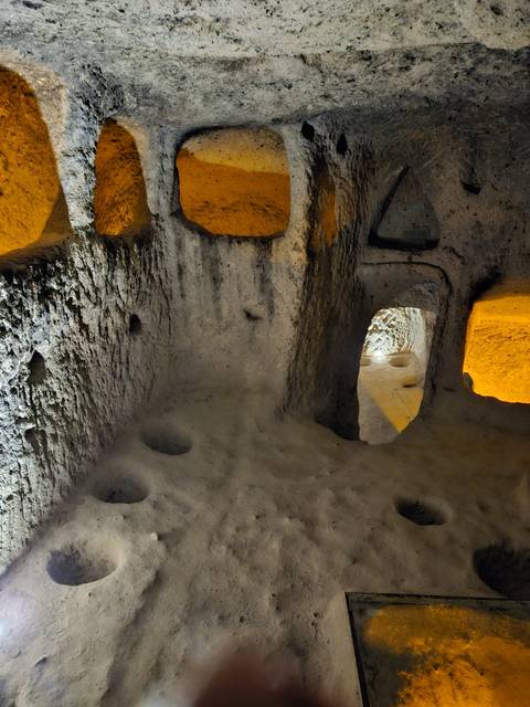       Underground cave passage with lights.
  