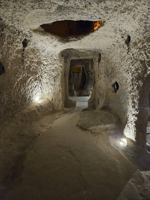       Cave interior with pathways.
  
