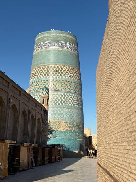 Ornate minaret under the blue sky.