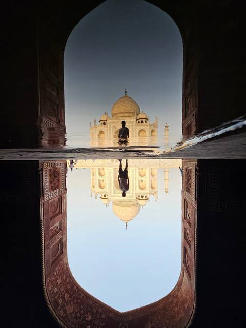 Reflection of the Taj Mahal in water.
