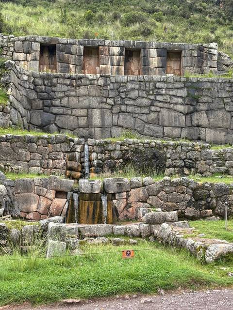 Water flowing through stone ruins.