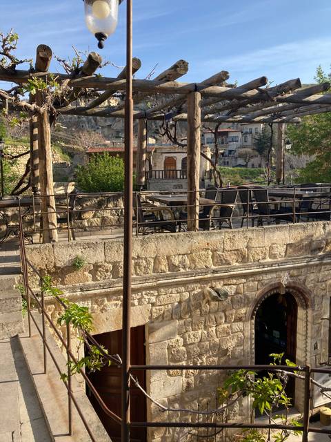 Stone terrace with views of a quaint town.