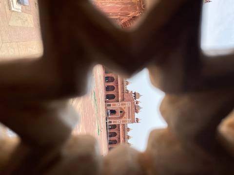 Peek through abstract structures at architectural site.