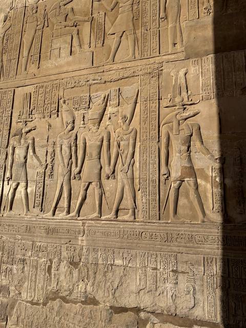 Close-up of ancient Egyptian carvings on a wall.