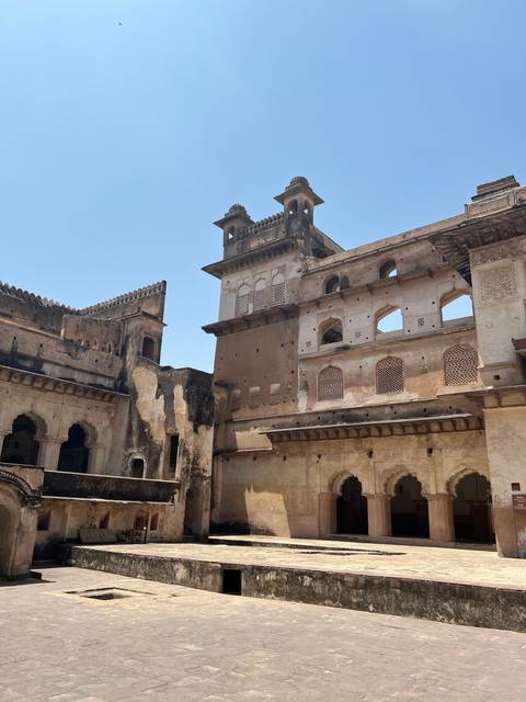 Historic building with intricate details under blue sky.