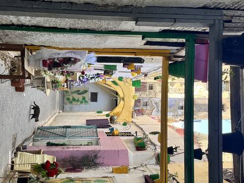       Colorful marketplace with decorations.
  