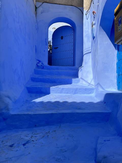       Blue-washed architecture with stairs.
  