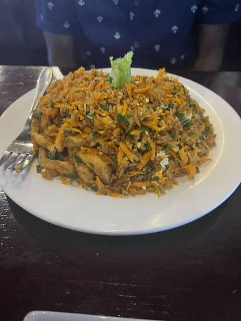       Plate of fried rice with vegetables.
  