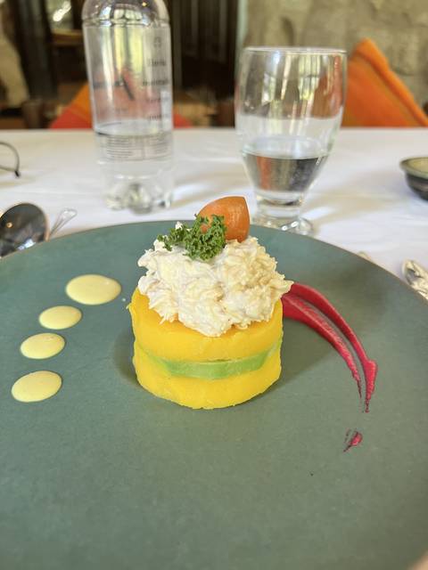 A plated dish of colorful, artistic food.