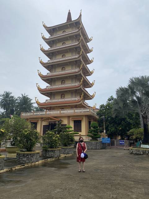 Pagoda in traditional architecture with a person standing.
