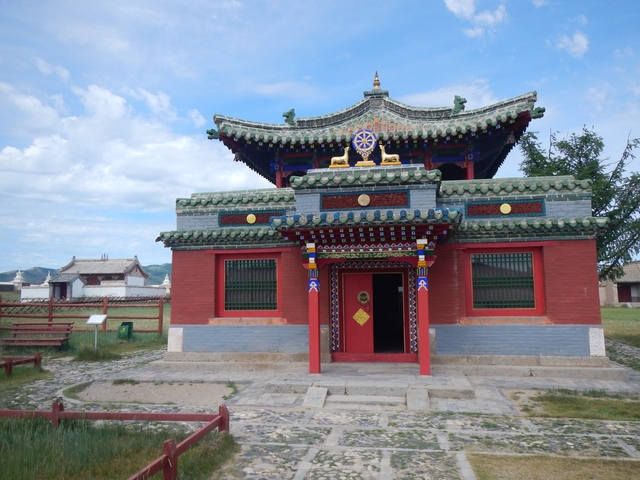 Traditional temple with colorful architecture and blue sky.