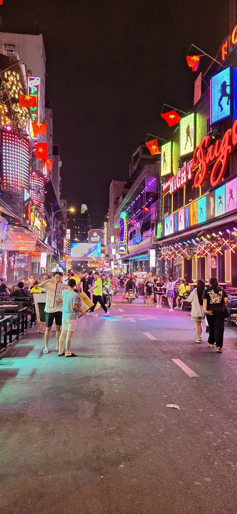 Busy nightlife scene with colorful neon lights