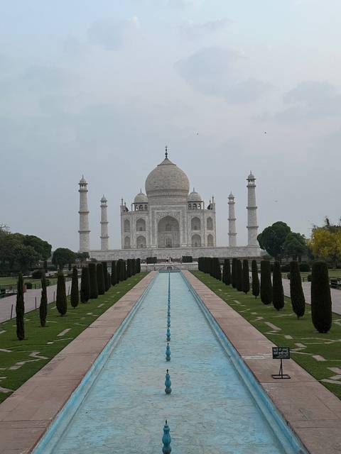 Taj Mahal with reflection pool and gardens.