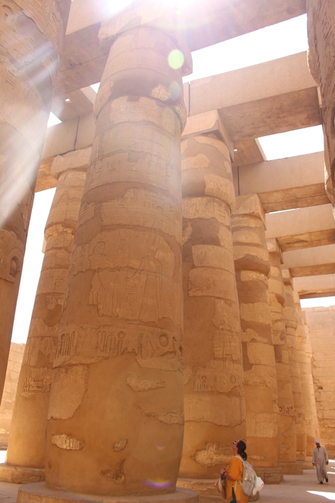       Close-up of ancient Egyptian columns with hieroglyphs.
  