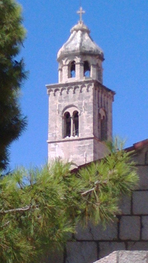 Blurry image of a stone bell tower.