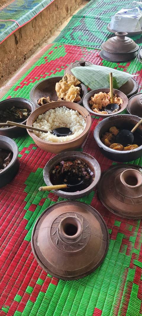       Various traditional Sri Lankan dishes served on a table.
  