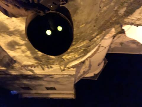 Dark image with unclear objects, possibly taken at night.