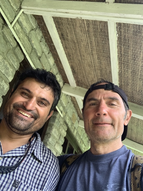 Two men smiling for a selfie.