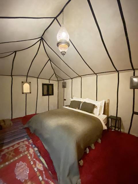 Interior of a tent with traditional Moroccan decor.