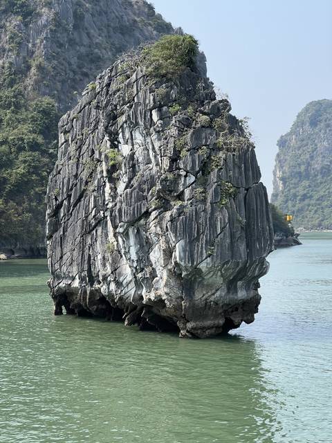 A rocky island formation in the water.