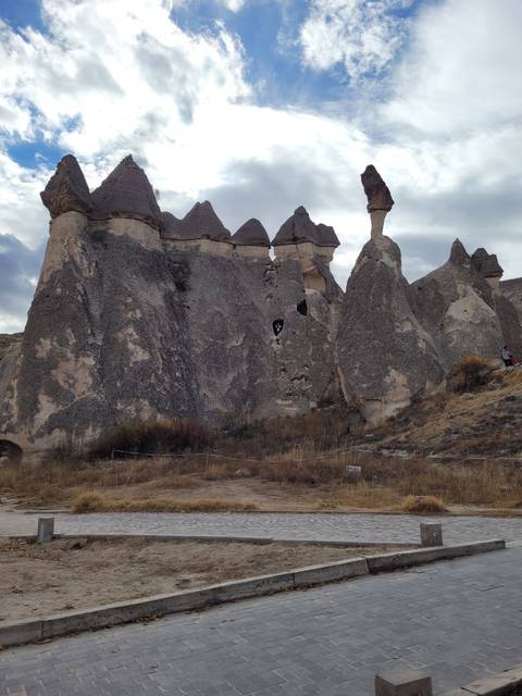Large rock formations with small openings.