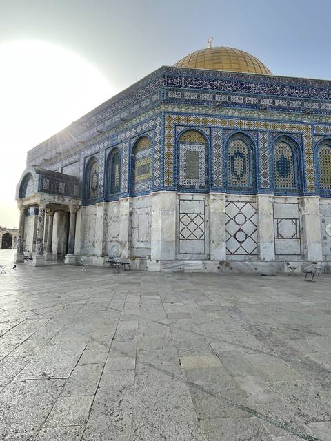 Close-up of a mosque's wall, including the Dome of the Rock.