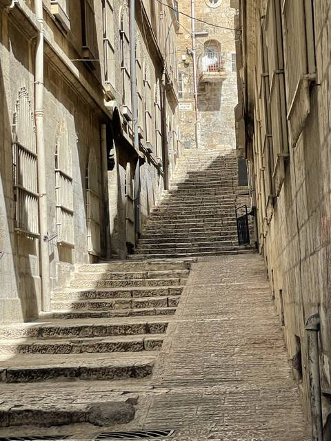 Covered alley in an old stone city.