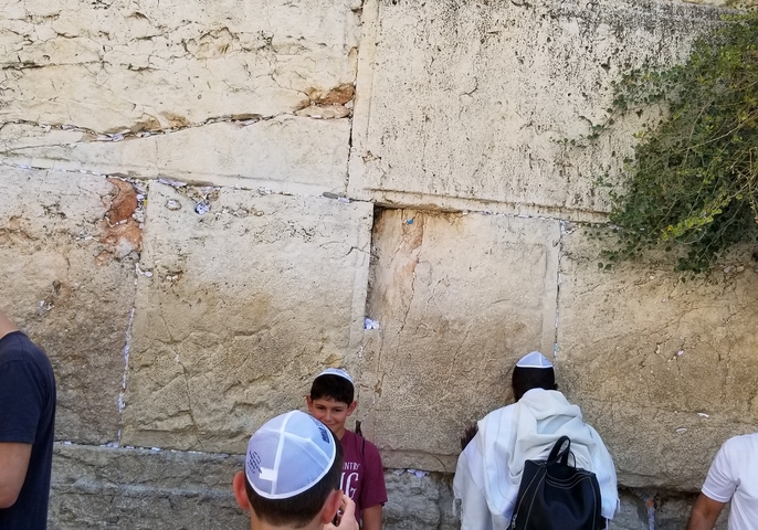People praying at the Western Wall.