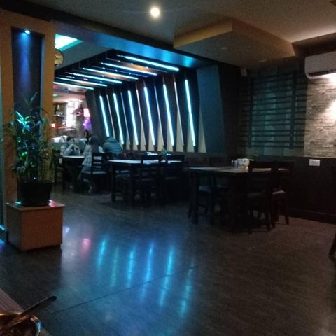       Dimly lit restaurant interior.
  