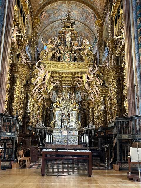An ornate interior featuring gold decoration and sculptures.