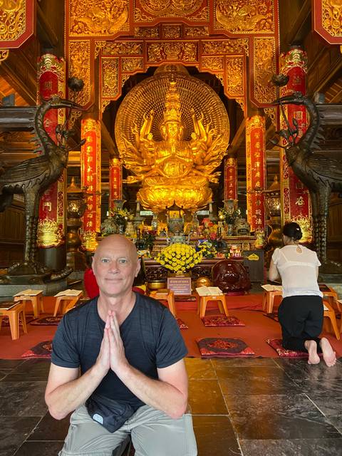 Indoor shot of a person at a shrine.