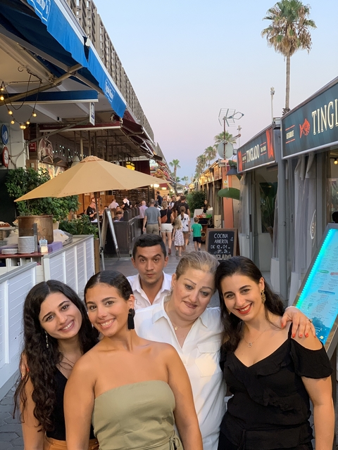 Group of people in an outdoor dining area.