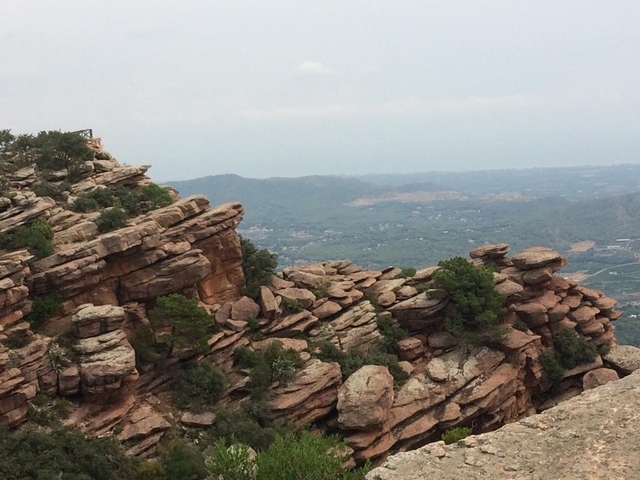       Rocky hills with a panoramic view of valleys.
  