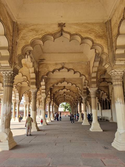 Ornate arches of a historical palace hallway.