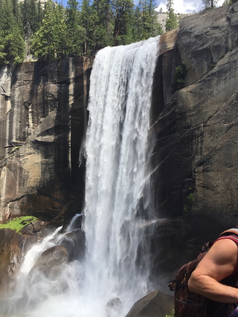 Majestic waterfall flowing down a rocky slope