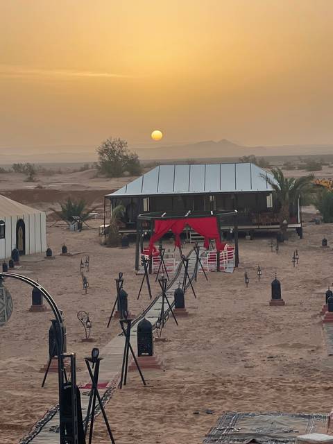       Sunset view of a desert campsite.
  
