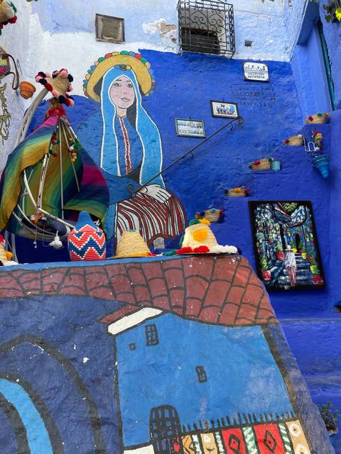       Colorful street art depicting a local figure.
  