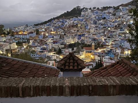 Aerial view of a city with a blue and white color scheme.