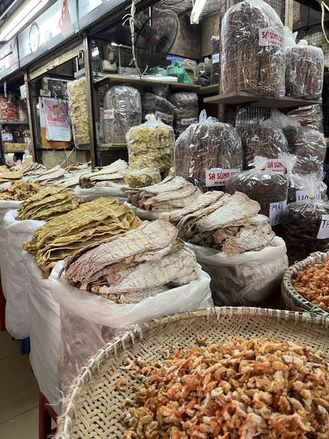 Dried seafood products displayed in a market setting.